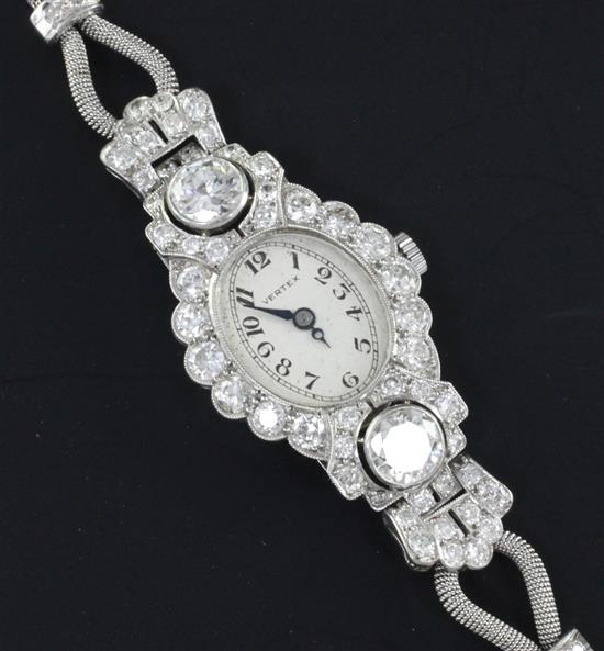 A ladys 1950s white gold and diamond set Vertex manual wind cocktail watch, approx. 6.5-7in.